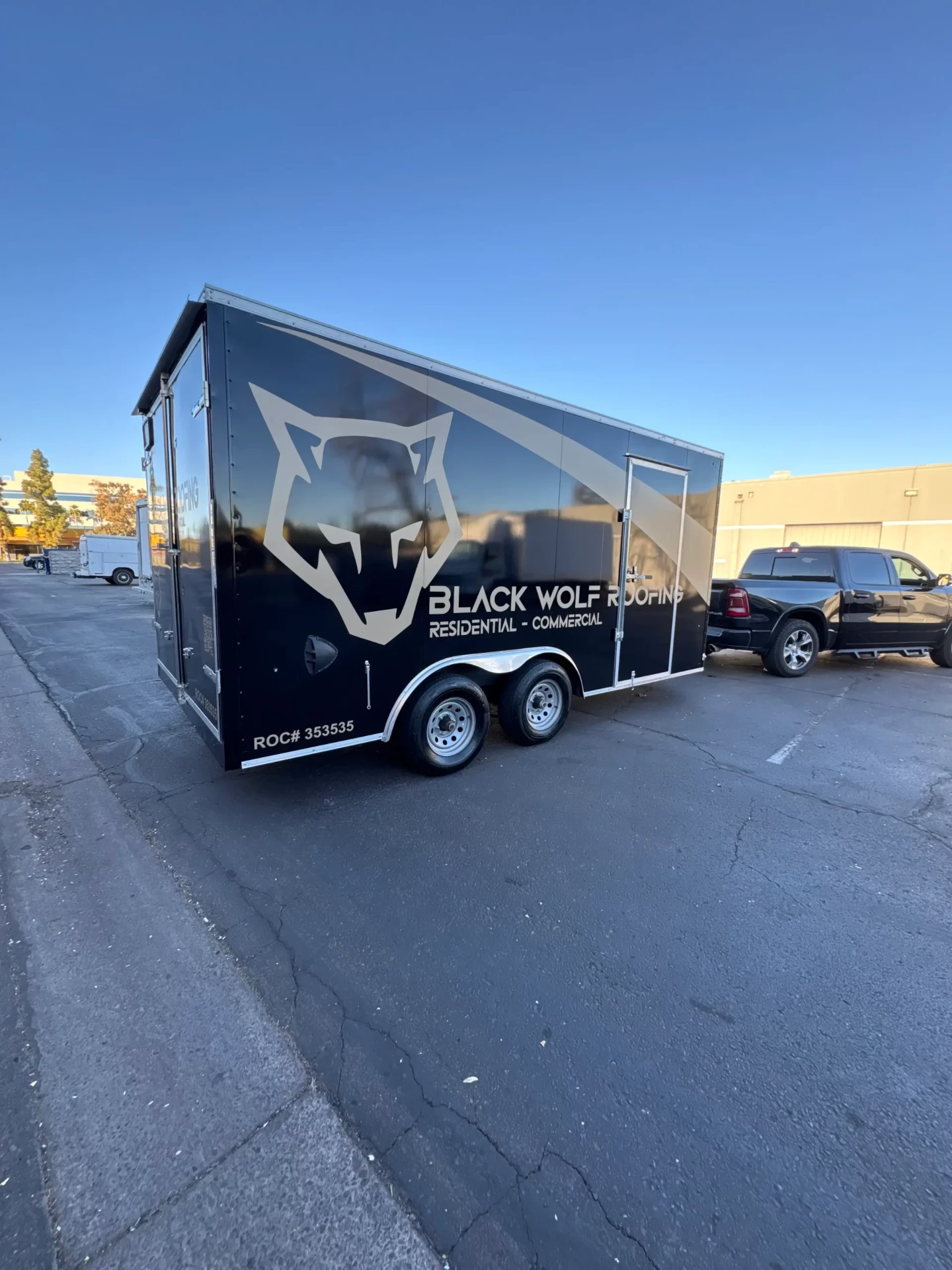 Black Wolf Roofing fleet trailer wrap rear three-quarter view