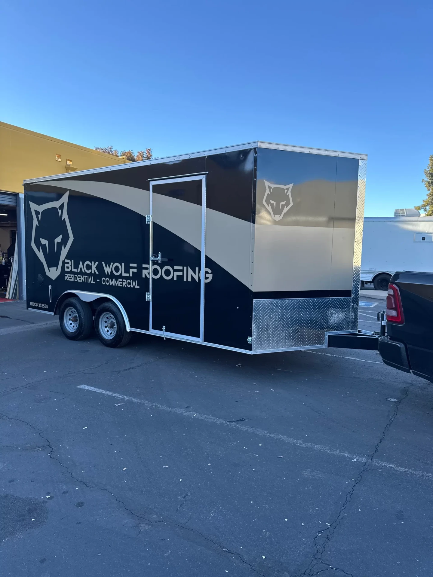 Black Wolf Roofing fleet trailer wrap full side view