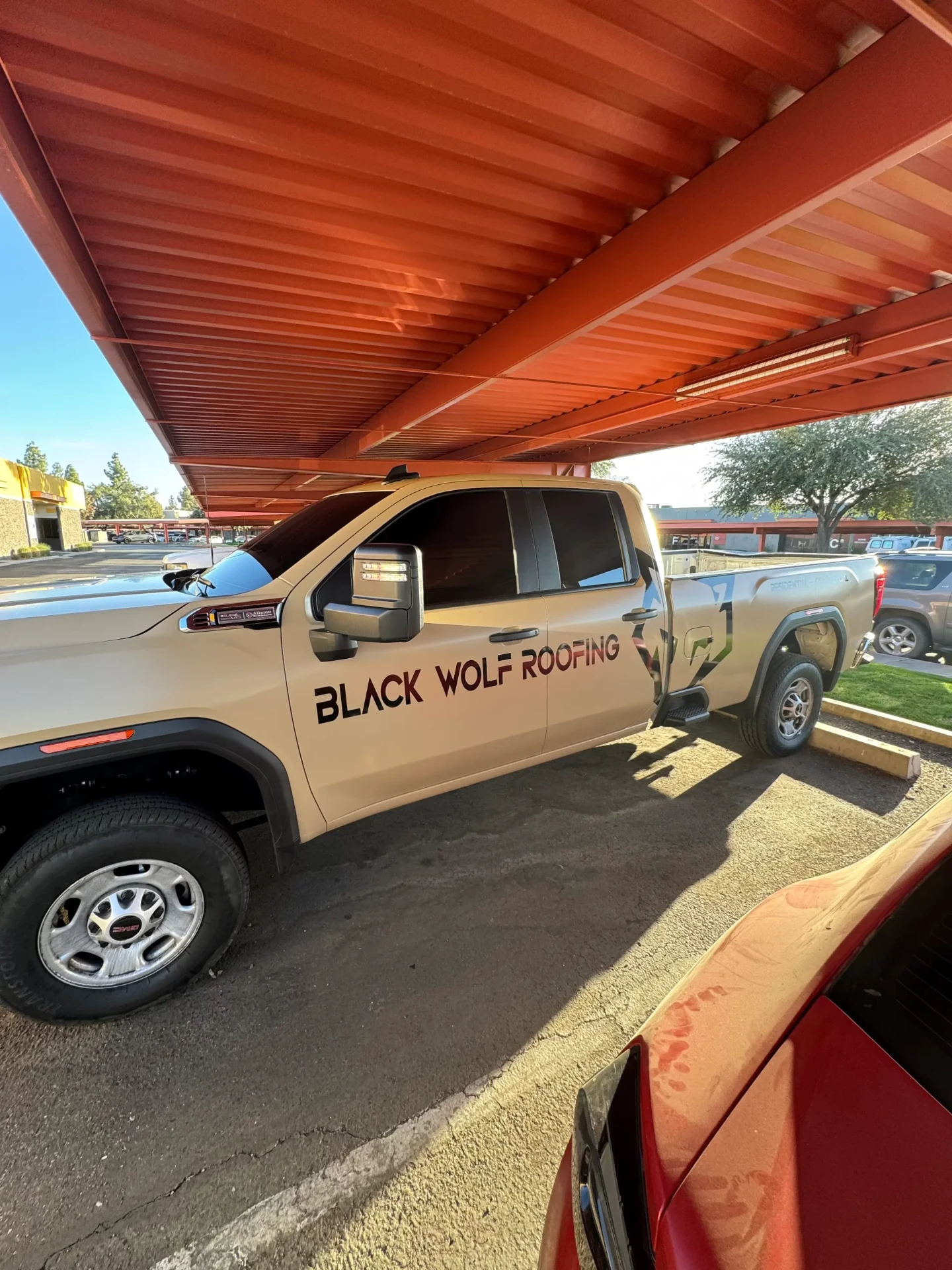 Black Wolf Roofing commercial truck wrap with logo and lettering