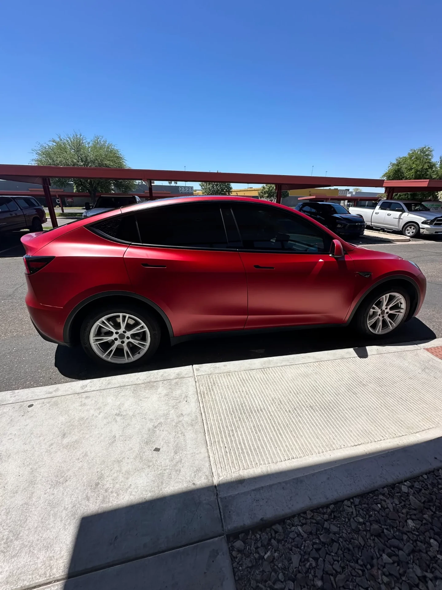 Satin red wrap on Tesla Model Y